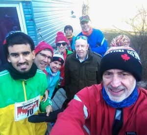 A group of runners pose for a photo.