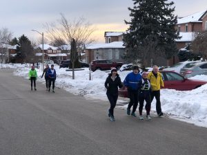 Runners along a street. 