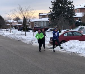 Runners on a street being silly. 