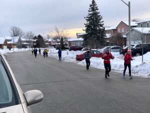 Runners on a side street. 