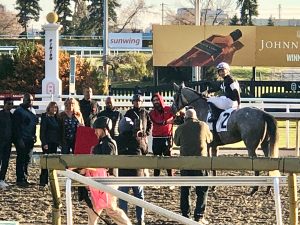 Presenting the winner's trophy for race 6 at Woodbine.